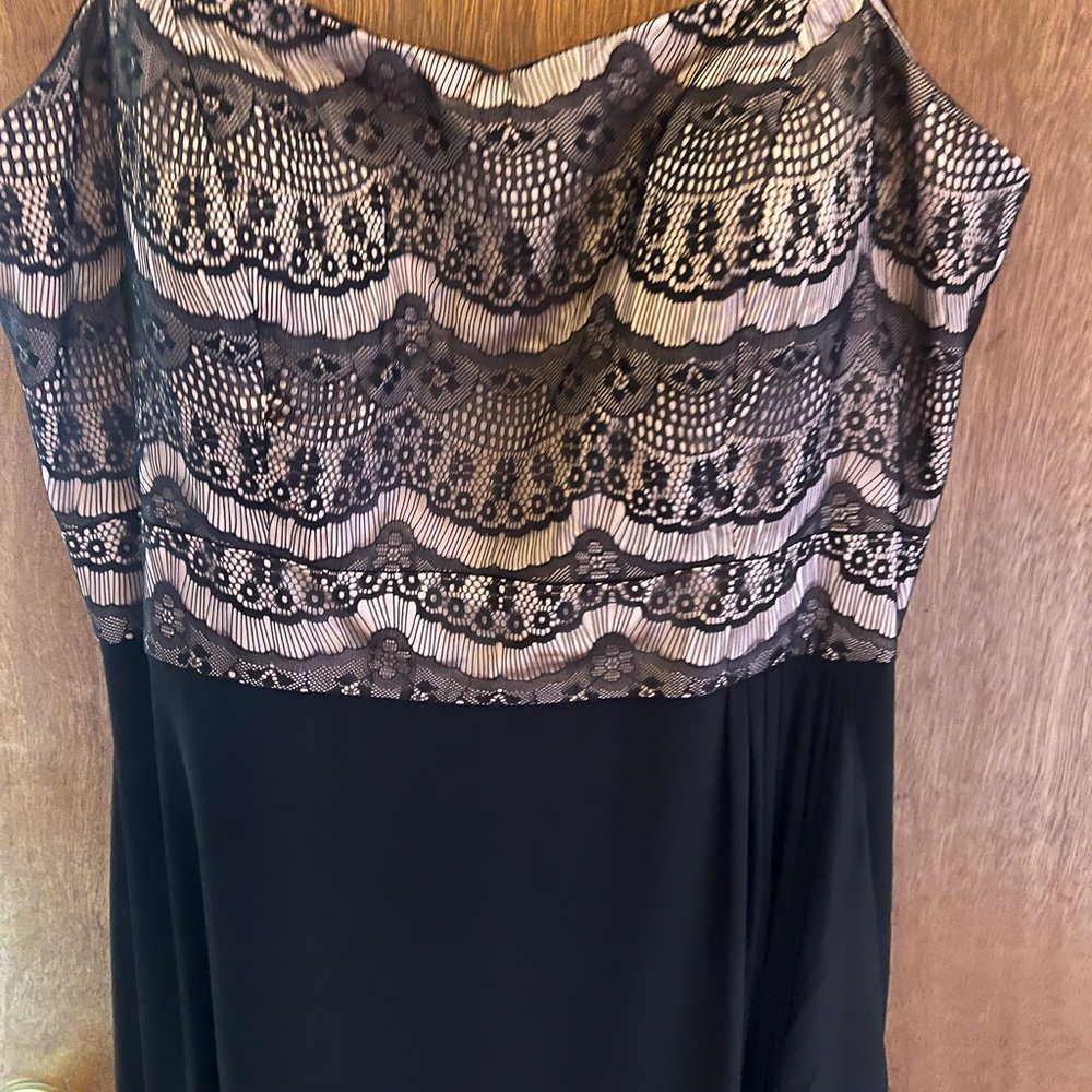 Black full length dress. New with tags. Never worn. Size 18